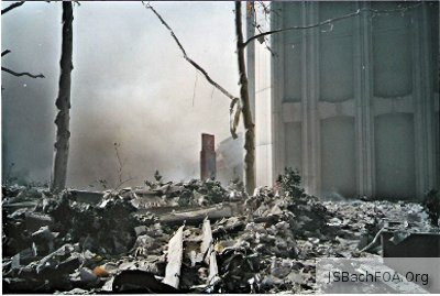 Wreckage from the South Tower, seen from the base of the still-standing North Tower - September 11, 2001